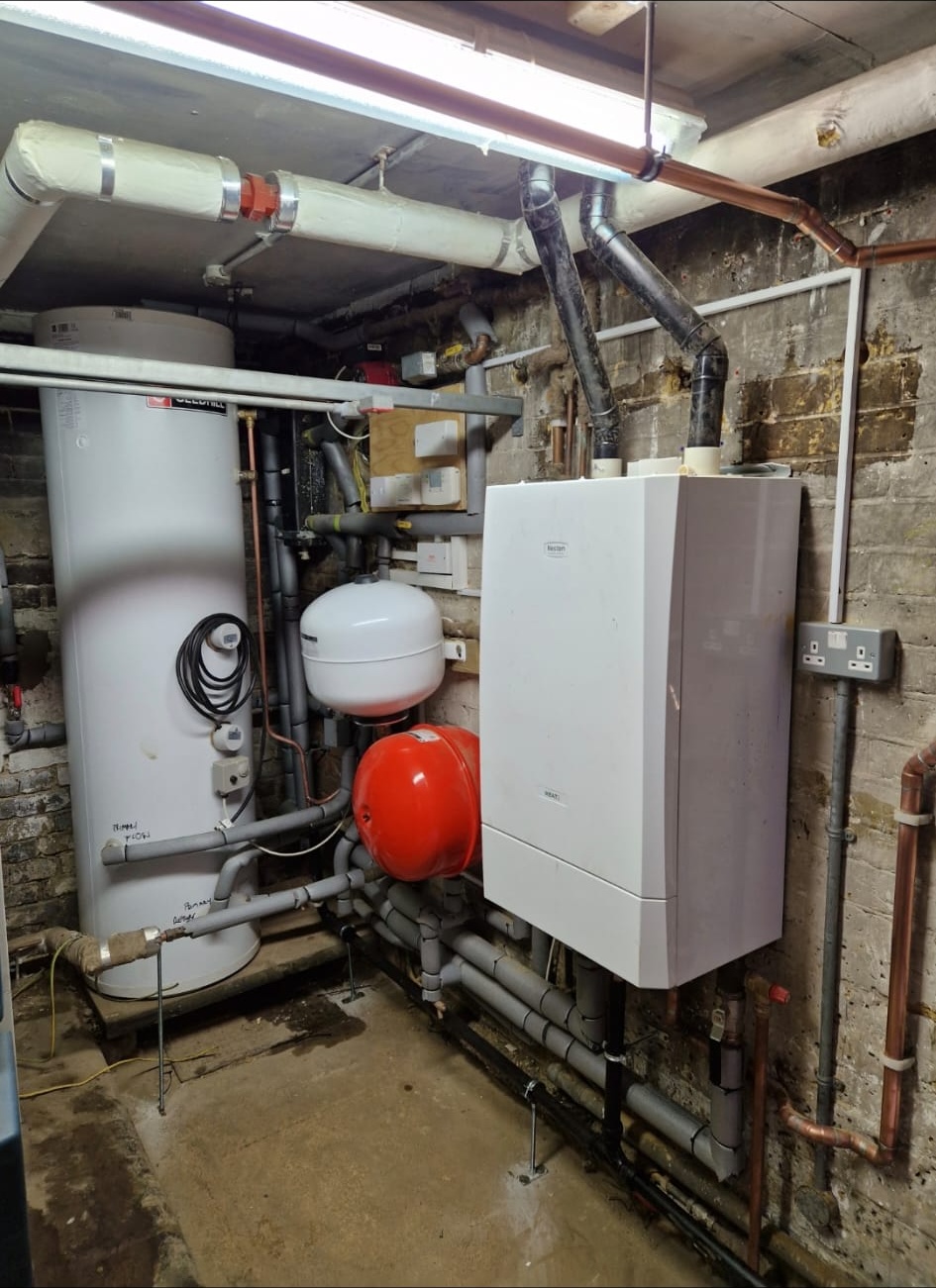 Boiler and unvented cylinder installation in a plant room with expansion vessels | DHP London.